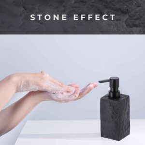 A demonstration of handwashing with soap lather, accompanied by a black stone-effect soap dispenser featuring a black pump on a clean countertop.