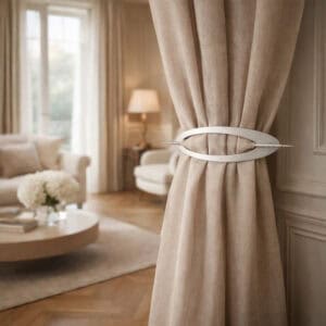 "Silver oval pin rod curtain tieback on linen drapes in an elegant classic living room"