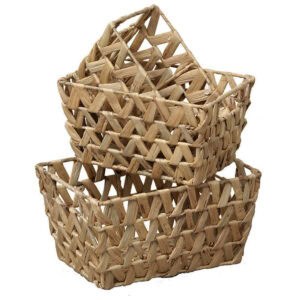 Set of three natural water hyacinth baskets with open braided weave, shown stacked empty on a white background.