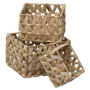 Set of three natural water hyacinth rectangular baskets with open braided weave, shown stacked empty on a white background.