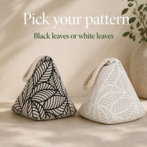Two cone door stoppers side by side, one with a black leaf print and one with a white leaf print, both with cream rope loops. On-image text: "Pick your pattern," "Black leaves or white leaves."