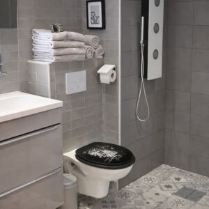 Modern bathroom with wall-hung toilet featuring black leopard print elongated seat