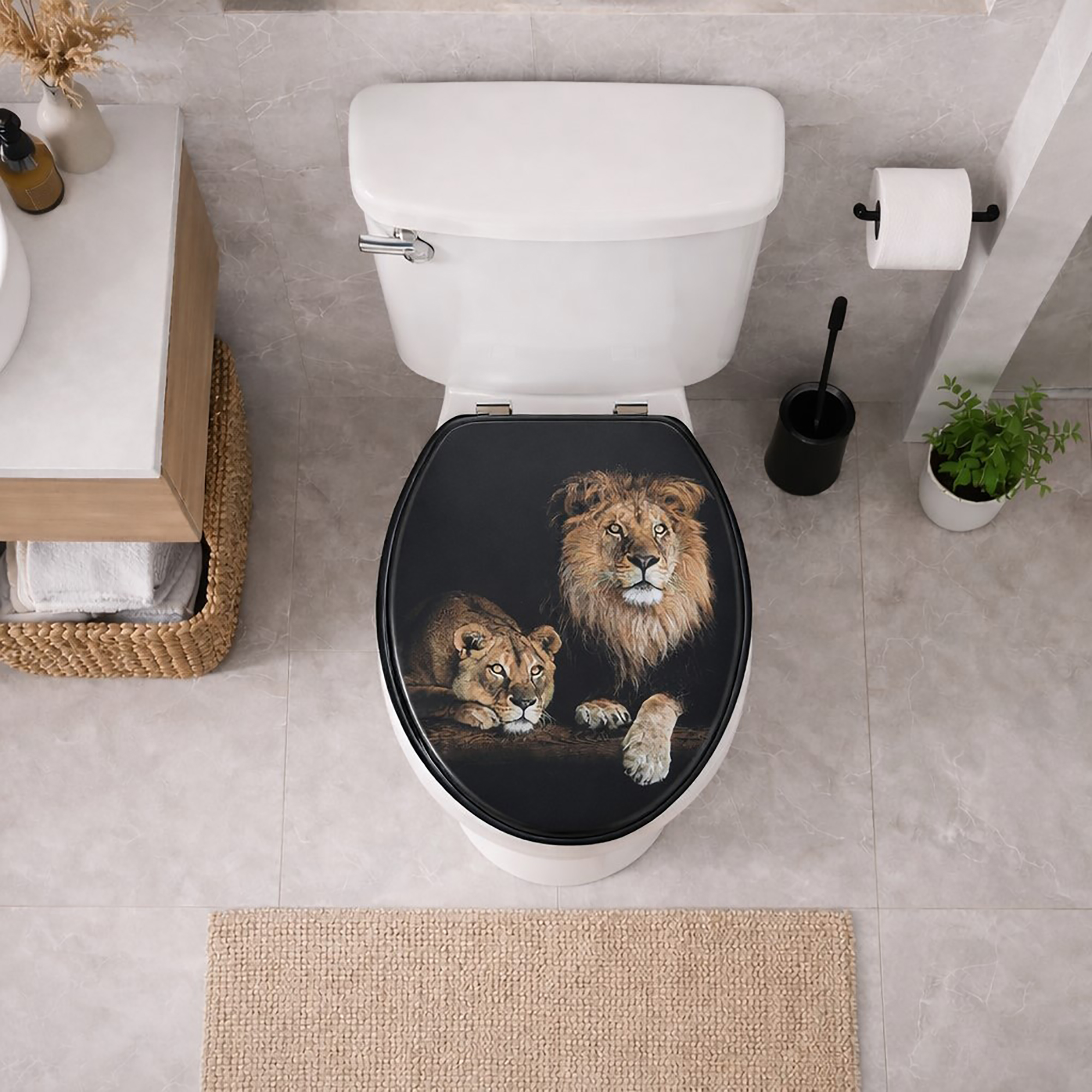 Top view of white toilet with black elongated lion and lioness toilet seat