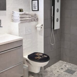 Modern bathroom with wall-hung toilet featuring lion and lioness print seat