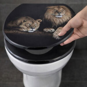 Close-up of black lion and lioness print elongated toilet seat being lifted by hand