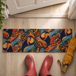 Top view of toucans coir entryway mat at an open front door next to red rain boots and a yellow umbrella