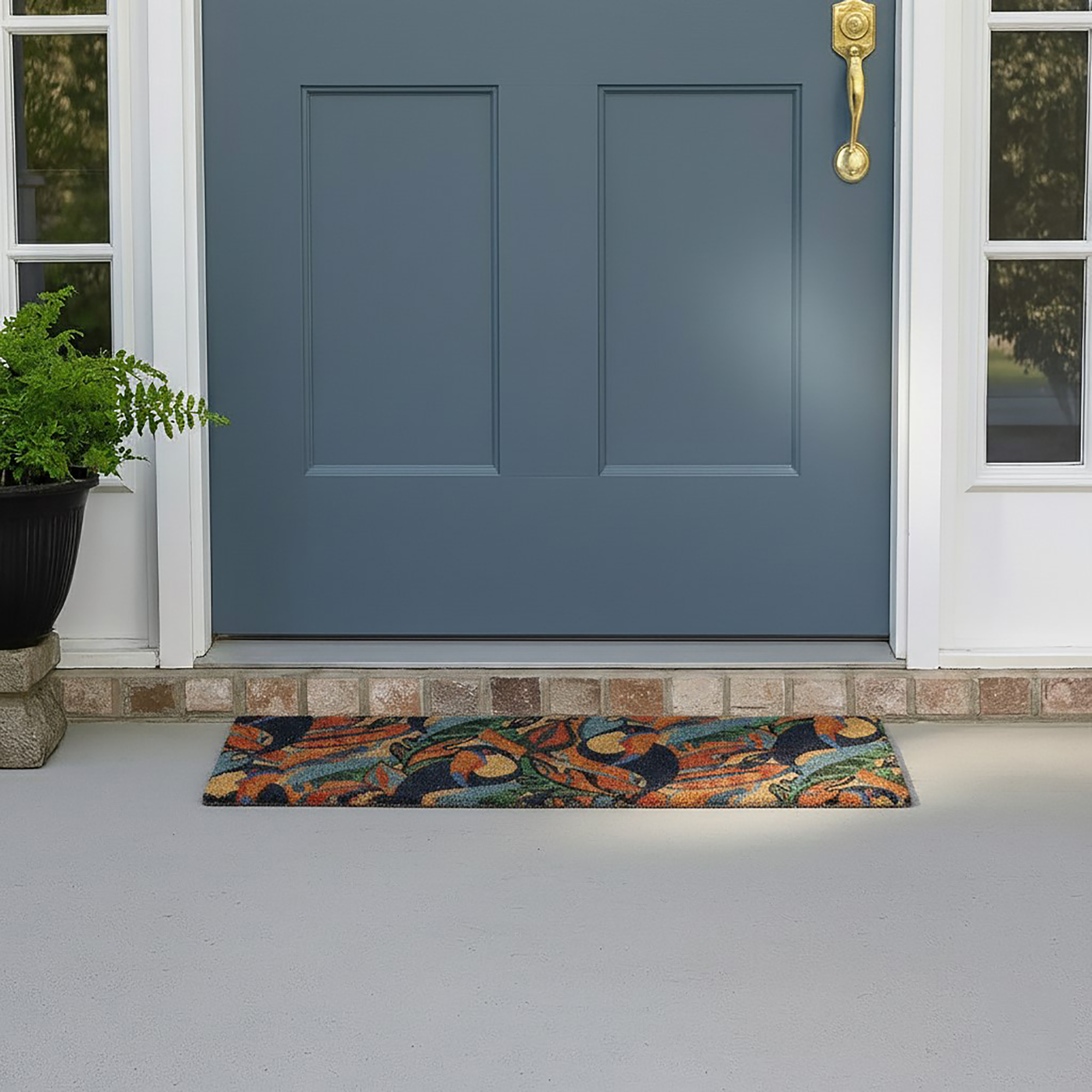 Toucan patterned doormat at blue front door entrance