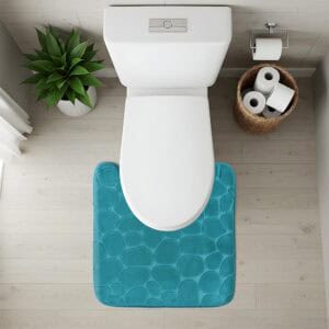 Top-down view of peacock blue pebble-texture contour mat fitted around toilet base