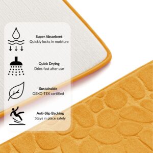 Mustard yellow contour mat with overlay showing icons and features for super absorbent, quick drying, OEKO-TEX certified, and anti-slip backing