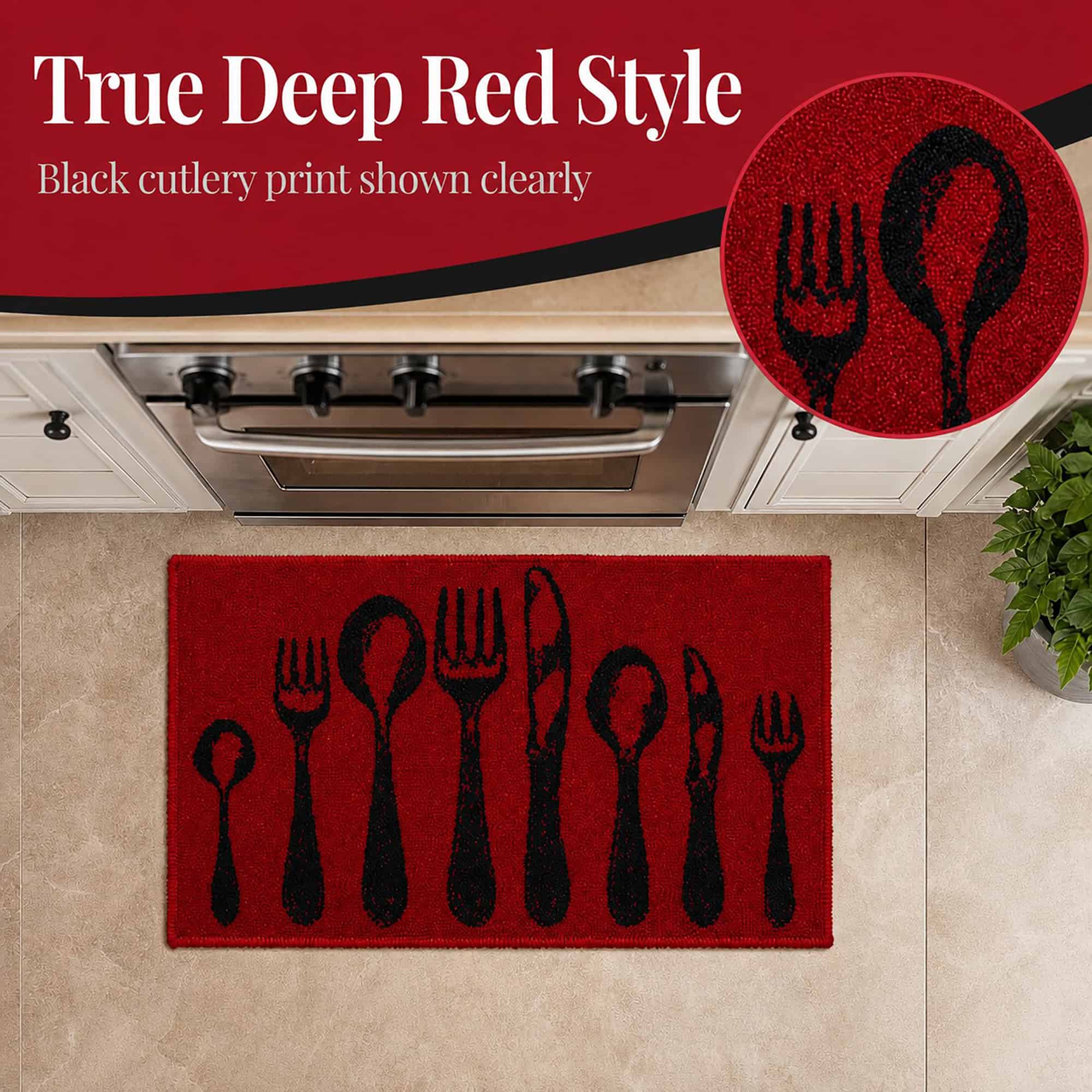 Close view of the deep red accent rug with bold black cutlery print, a circular inset magnifying the textured fork and spoon design near a stove.