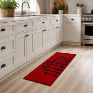 Long red cutlery runner rug placed along white cabinets in a bright kitchen, styling the forty eight inch runner in a real setting.