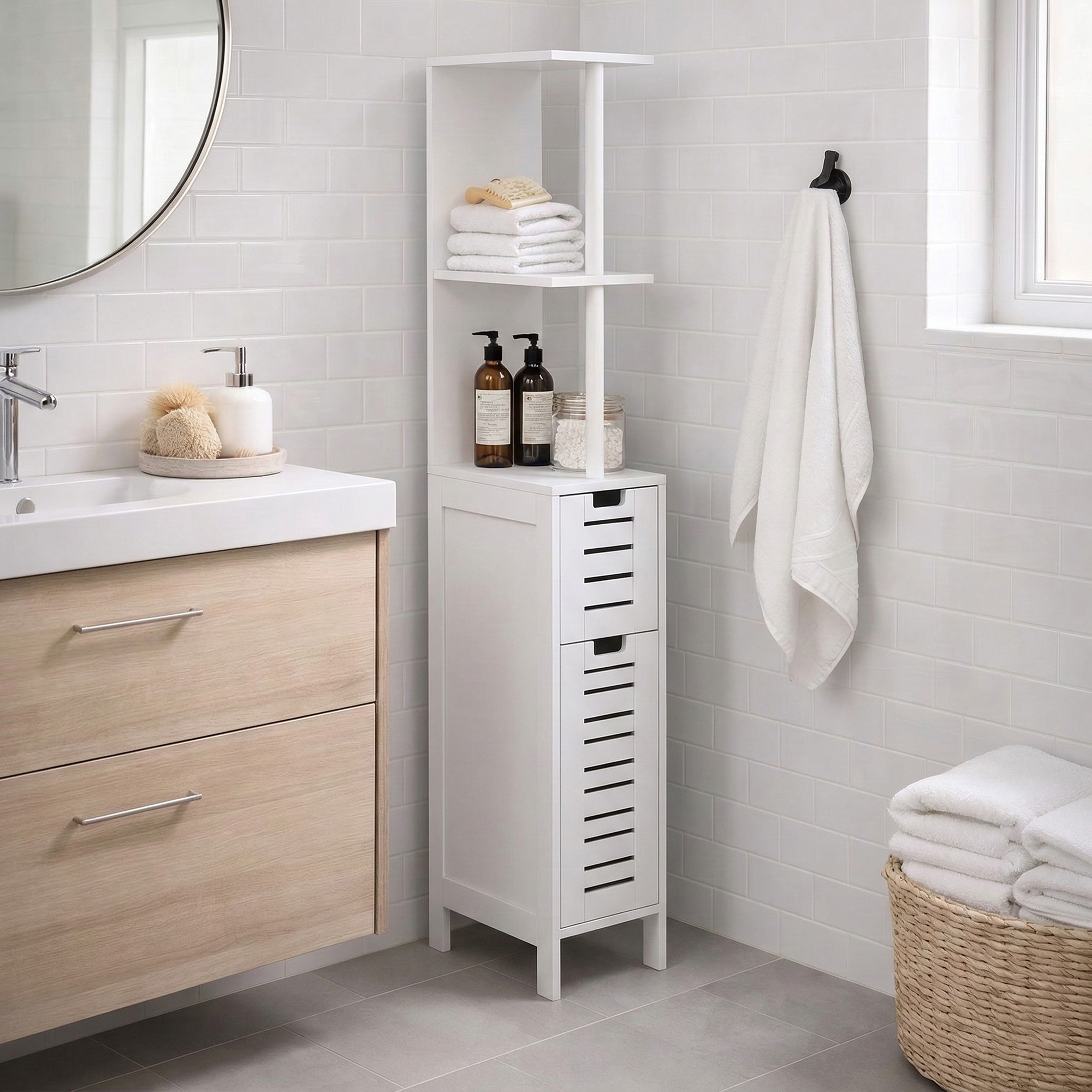 "Slim white freestanding bathroom cabinet with open shelves and two louvered drawers next to a sink"