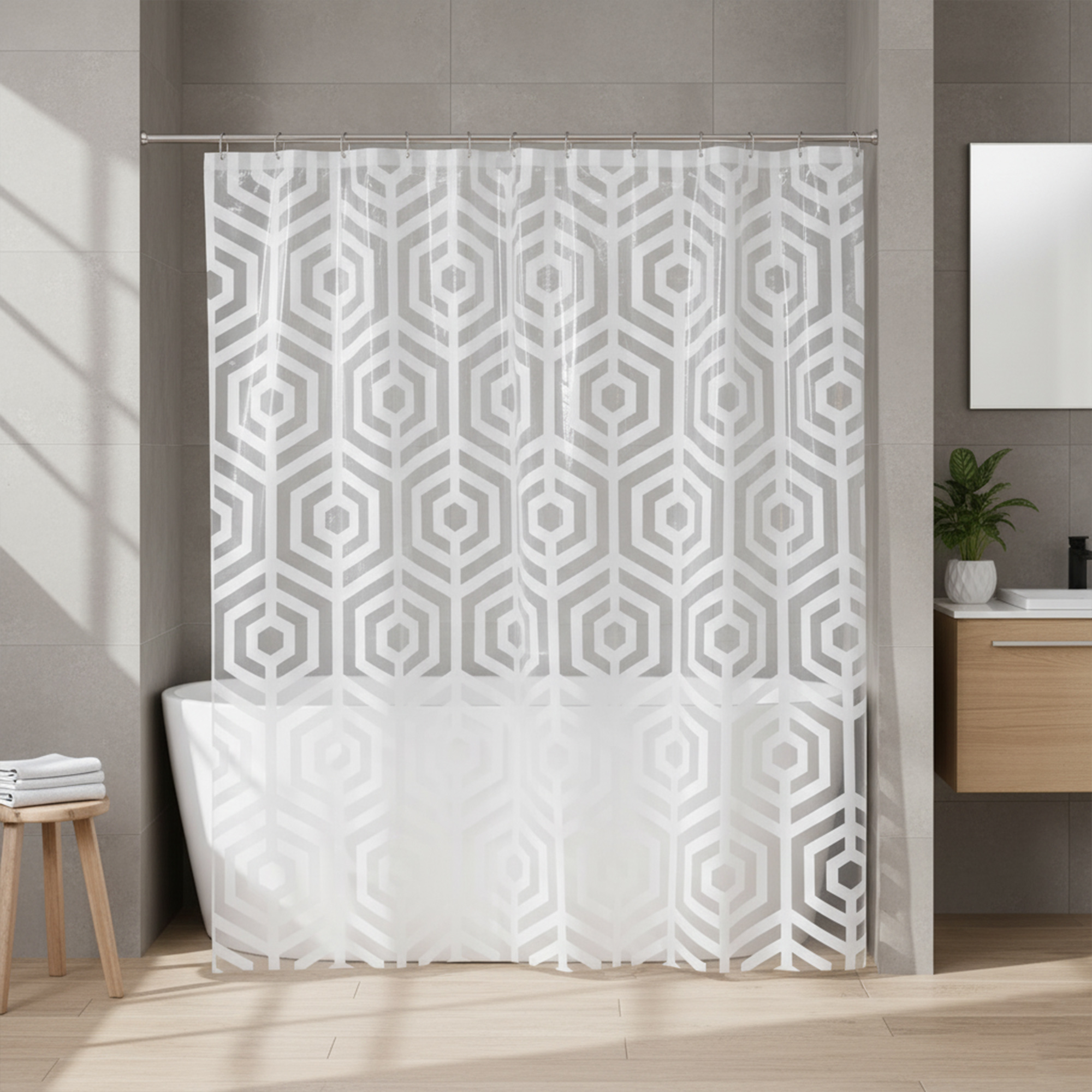 Clear PEVA shower curtain with white geometric design over bathtub