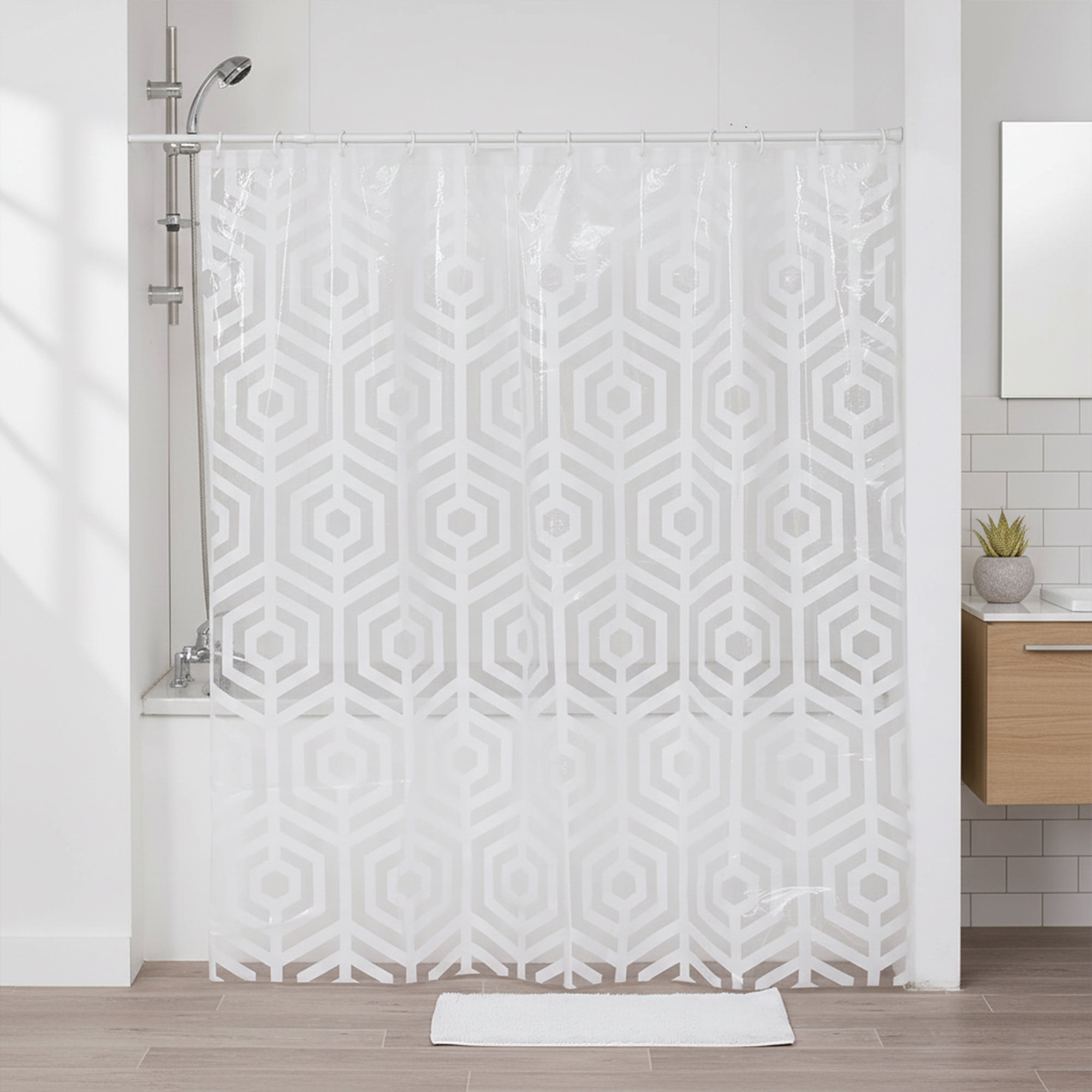Transparent shower curtain with white hexagon pattern in bright bathroom