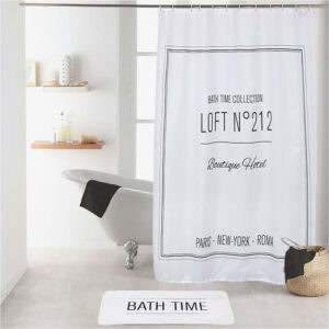 White bathtub setup with Loft N°212 shower curtain and bath mat