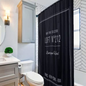 Loft N°212 black printed shower curtain displayed in modern bathroom