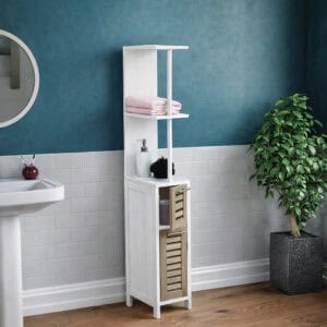 "White freestanding bathroom cabinet with open shelves and two-tone natural wood louvered drawers against teal wall"