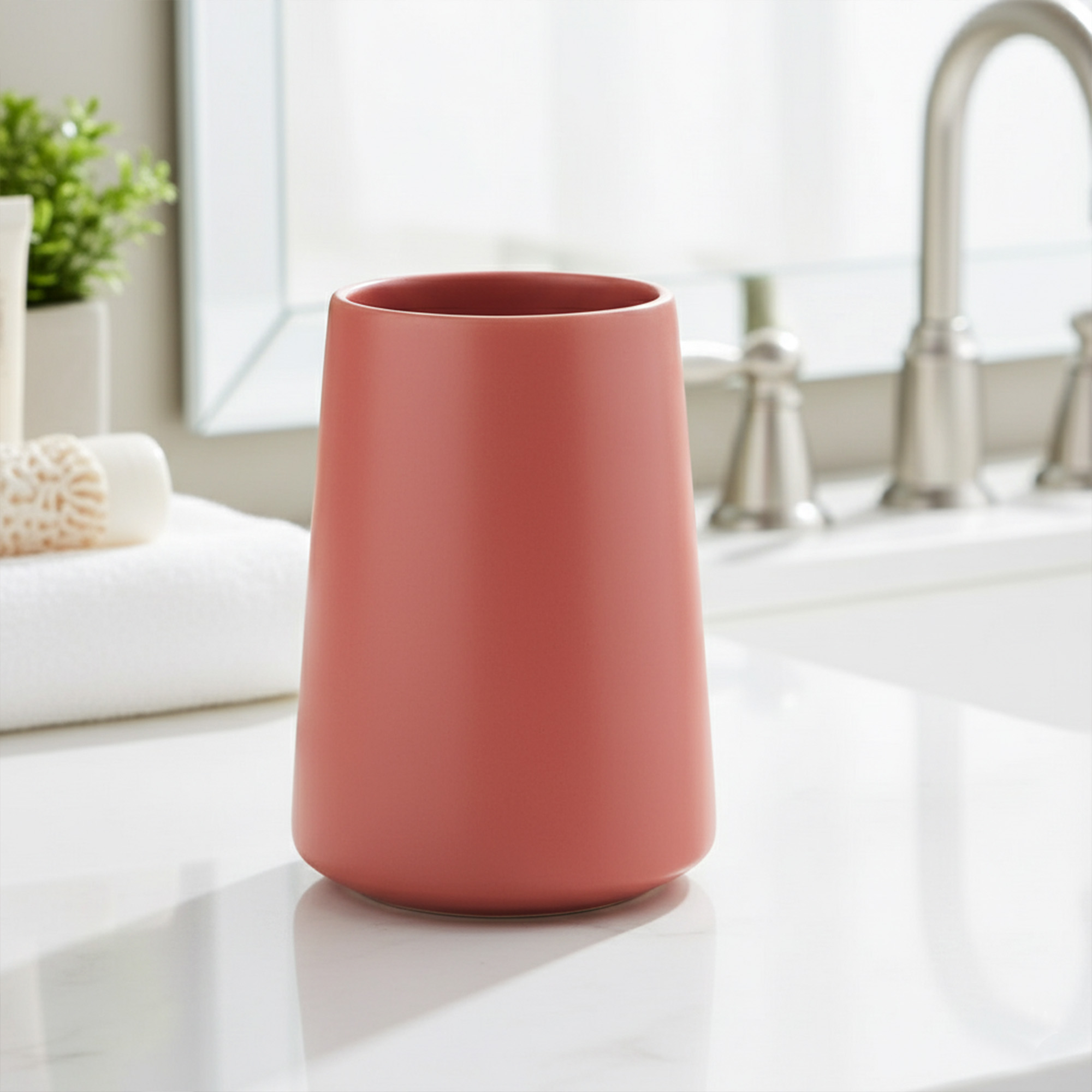 Terracotta bathroom tumbler toothbrush holder on vanity
