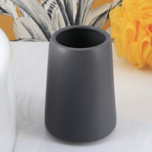 Close-up of gray matte tumbler toothbrush holder