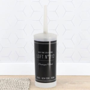 "Black and white Bath Time Collection toilet brush on hexagon tile floor"