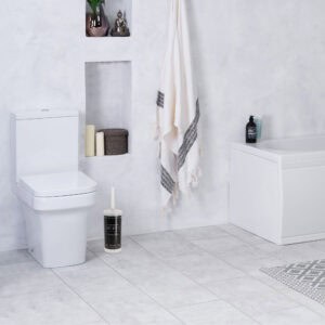 "Modern toilet brush with hotel-inspired design in minimalist white bathroom"