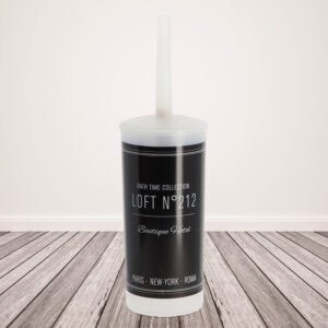 "Boutique Hotel toilet brush and holder on wooden deck surface"