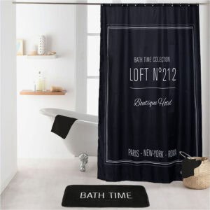 Black bath mat coordinated with matching black "Boutique Hotel" shower curtain in white bathroom