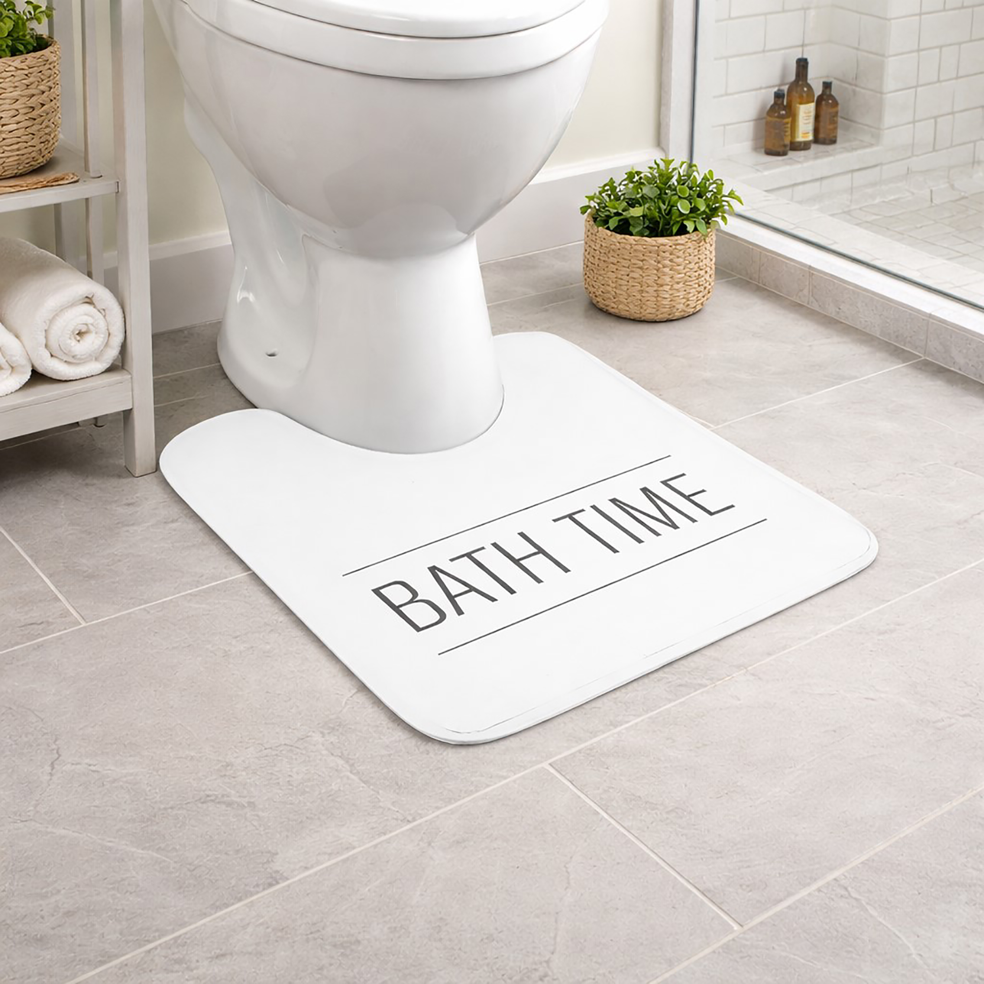 "White 'Bath Time' contour rug around toilet base on gray tile floor"