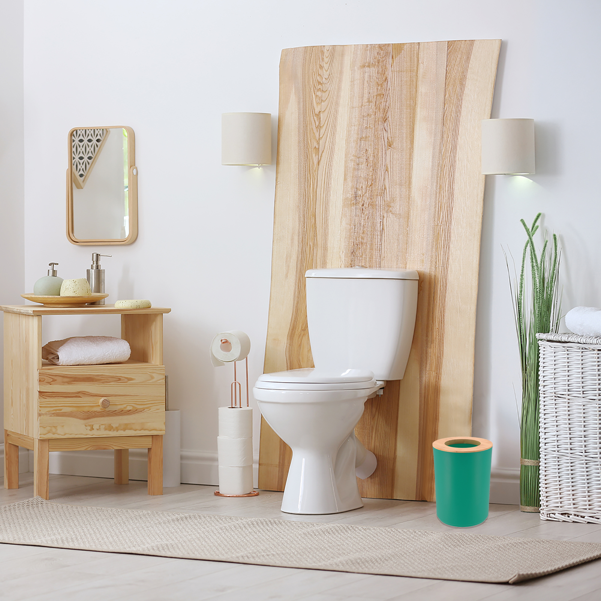 Green bathroom trash can with bamboo top placed near toilet