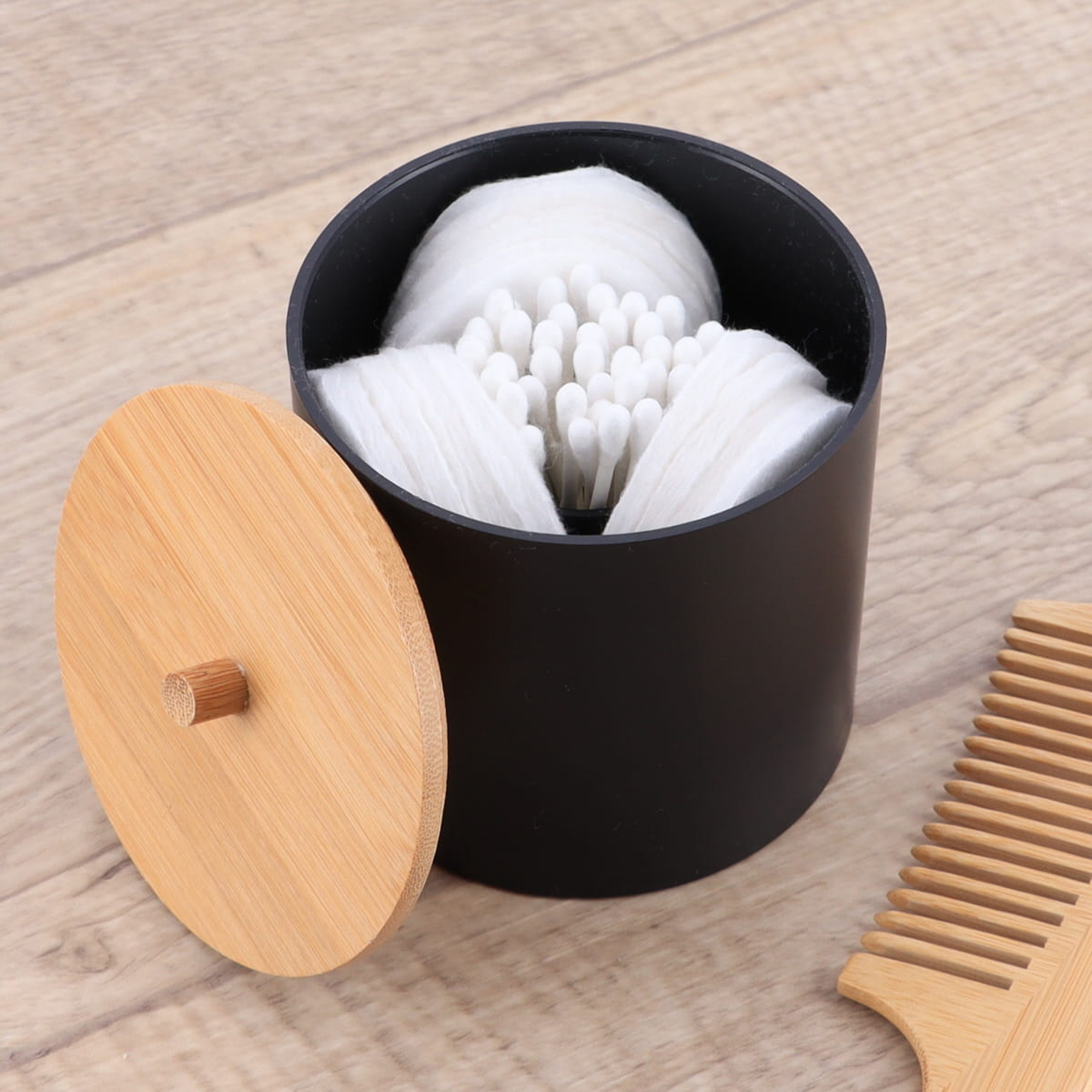 Black cotton swab holder with bamboo lid and divided interior