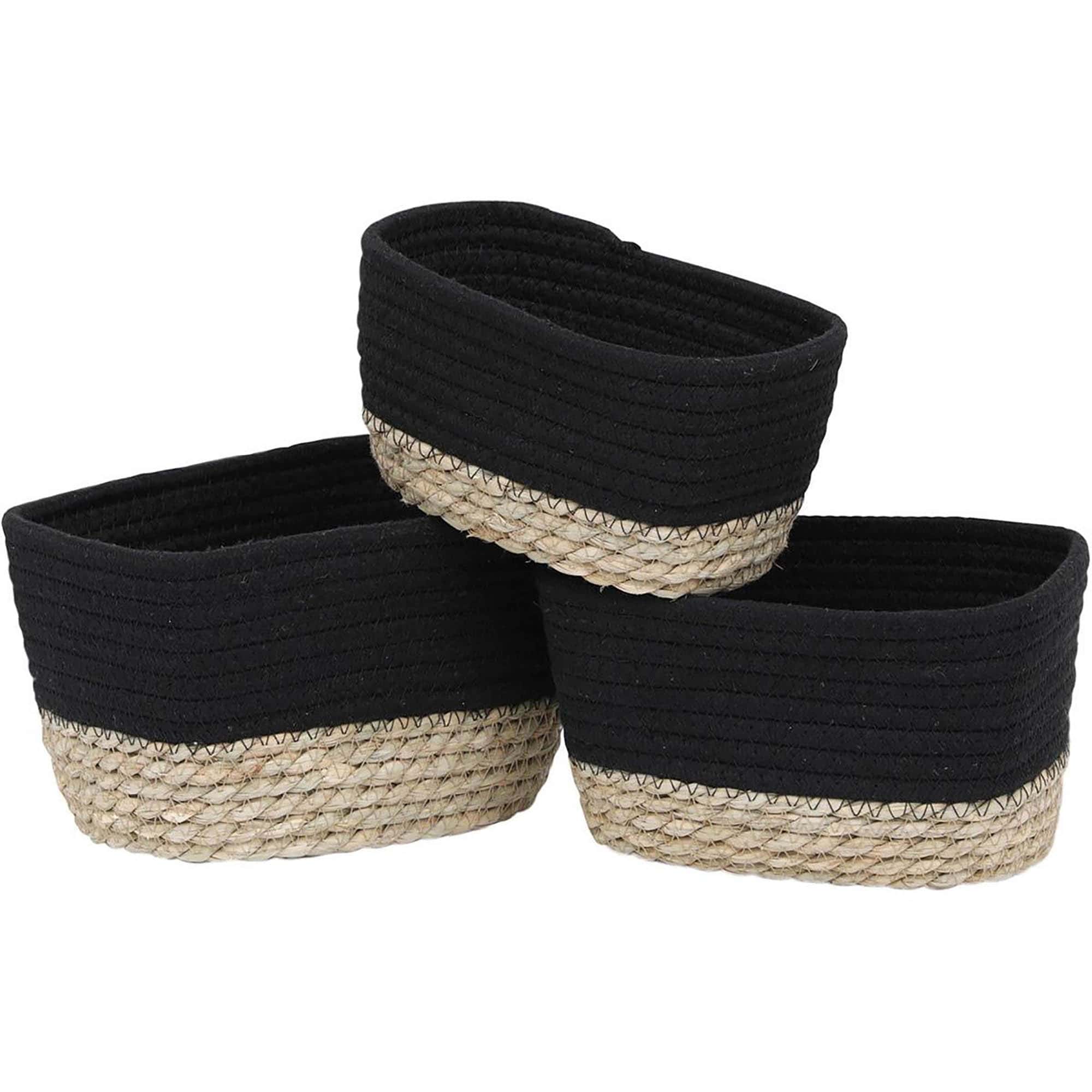 Set of three black cotton rope and natural seagrass oval storage baskets shown empty on a white background.
