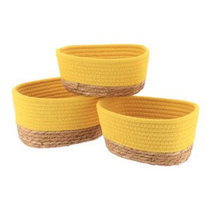 Set of three yellow cotton rope and natural seagrass oval storage baskets shown empty on a white background.