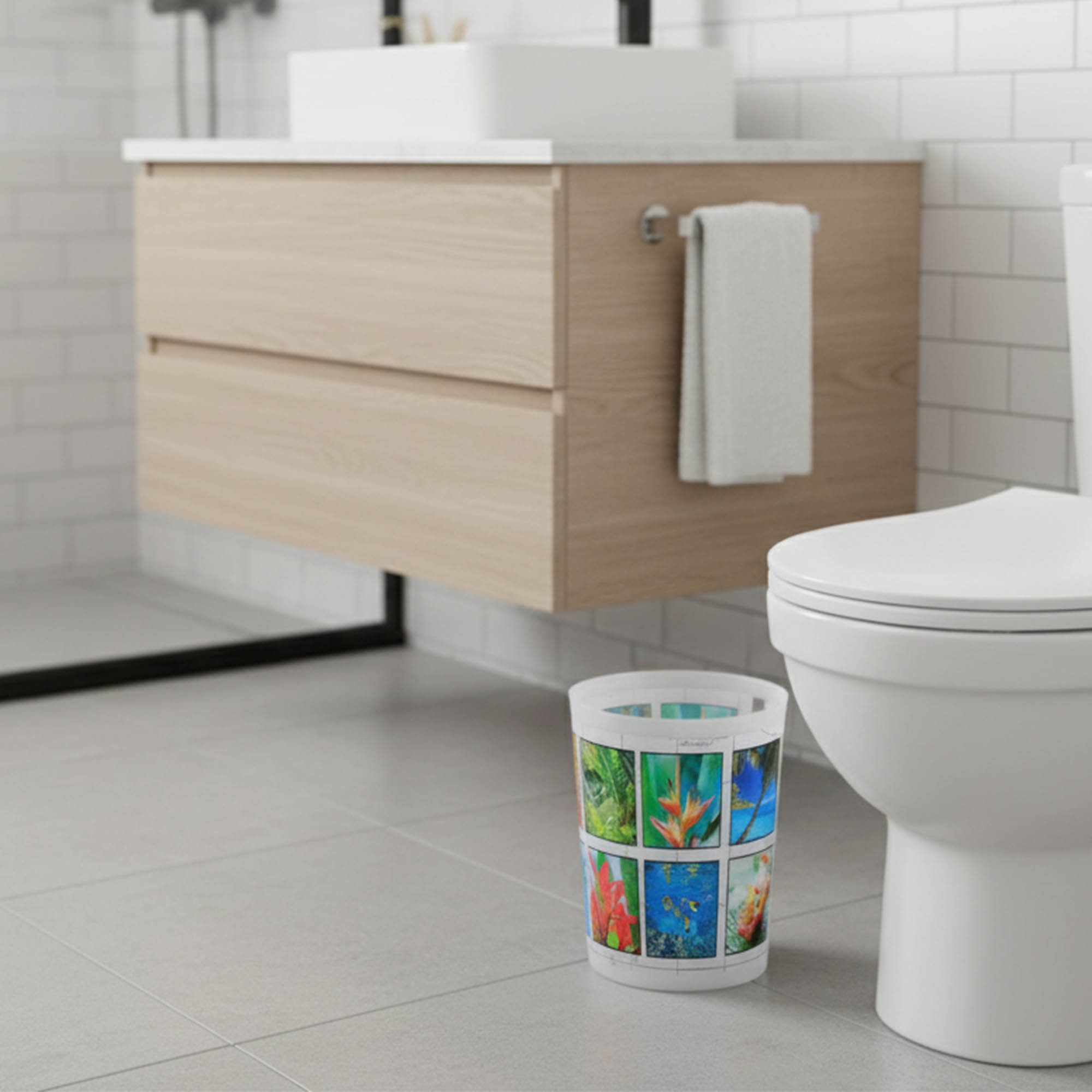 Tropical island print waste basket next to modern toilet
