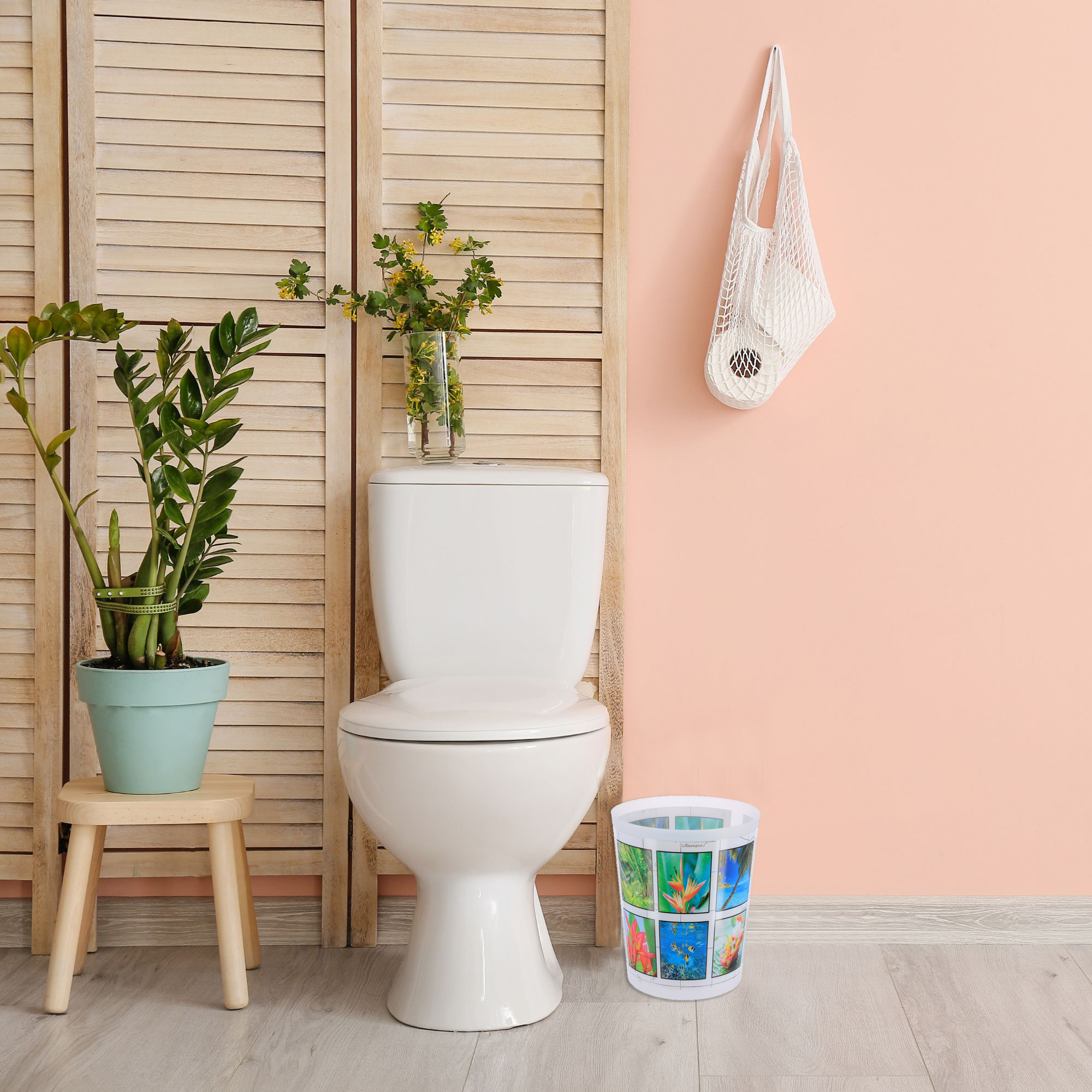 Colorful island design trash can in bathroom setting