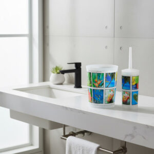 Image 2: Tropical-print waste basket and toilet brush displayed on bathroom countertop