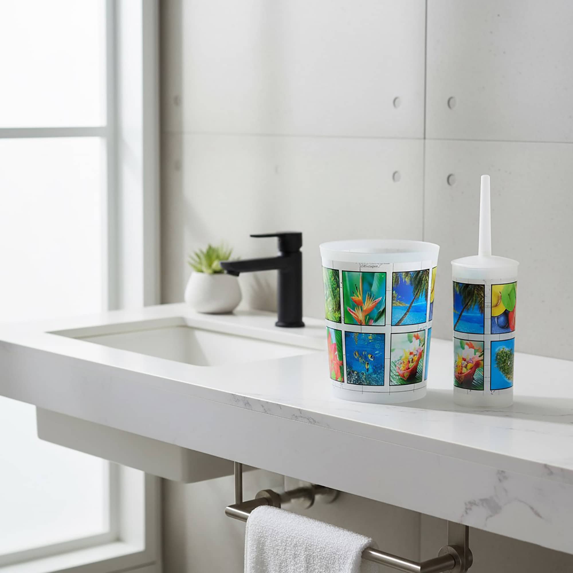 Image 2: Tropical-print waste basket and toilet brush displayed on bathroom countertop