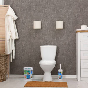 Image 3: Tropical-print trash bin and toilet brush placed beside a toilet in a bathroom