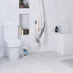 "Island-themed toilet brush in minimalist white bathroom corner"