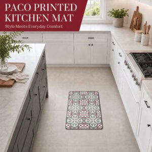 The kitchen mat placed on a tiled floor in a bright modern kitchen with white cabinets and a gas range, bringing pattern and comfort underfoot.