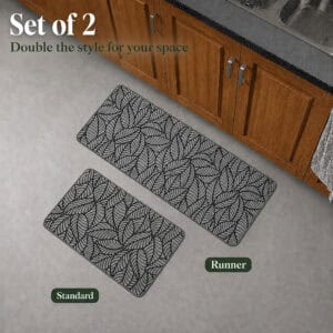 Grey two-piece kitchen mat set, a standard mat beside a longer runner, shown together on the floor near wood cabinets.