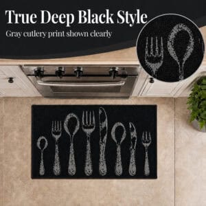 Close view of the deep black accent rug with gray cutlery print, a circular inset magnifying the textured fork and spoon design near a stove.