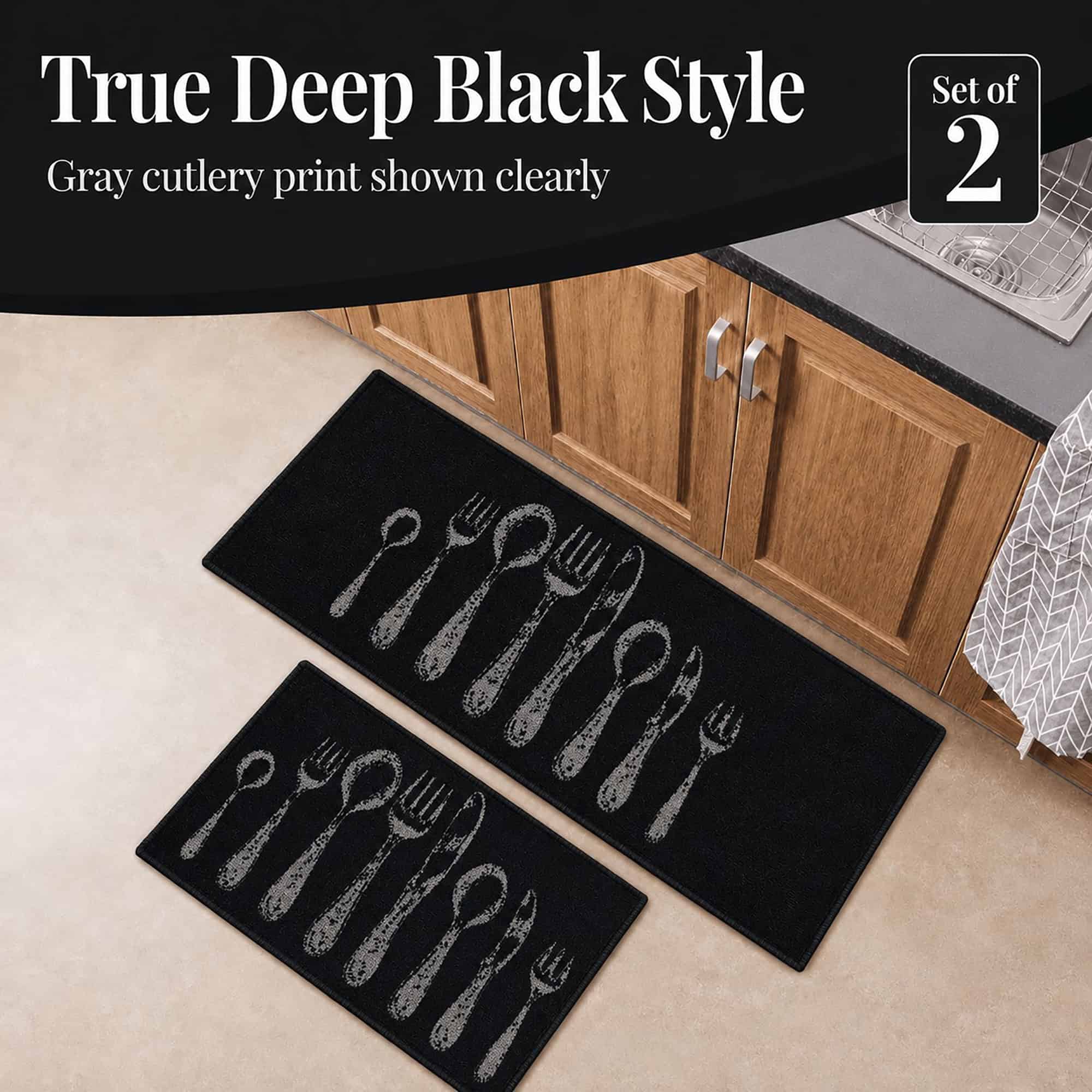 Close view of the black kitchen set with a distressed gray cutlery print, a corner badge noting the set of two pieces.