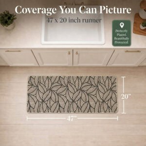 Overhead view of a beige leaf-print kitchen runner with arrows marking forty-seven inches long by twenty inches wide for narrow spaces.