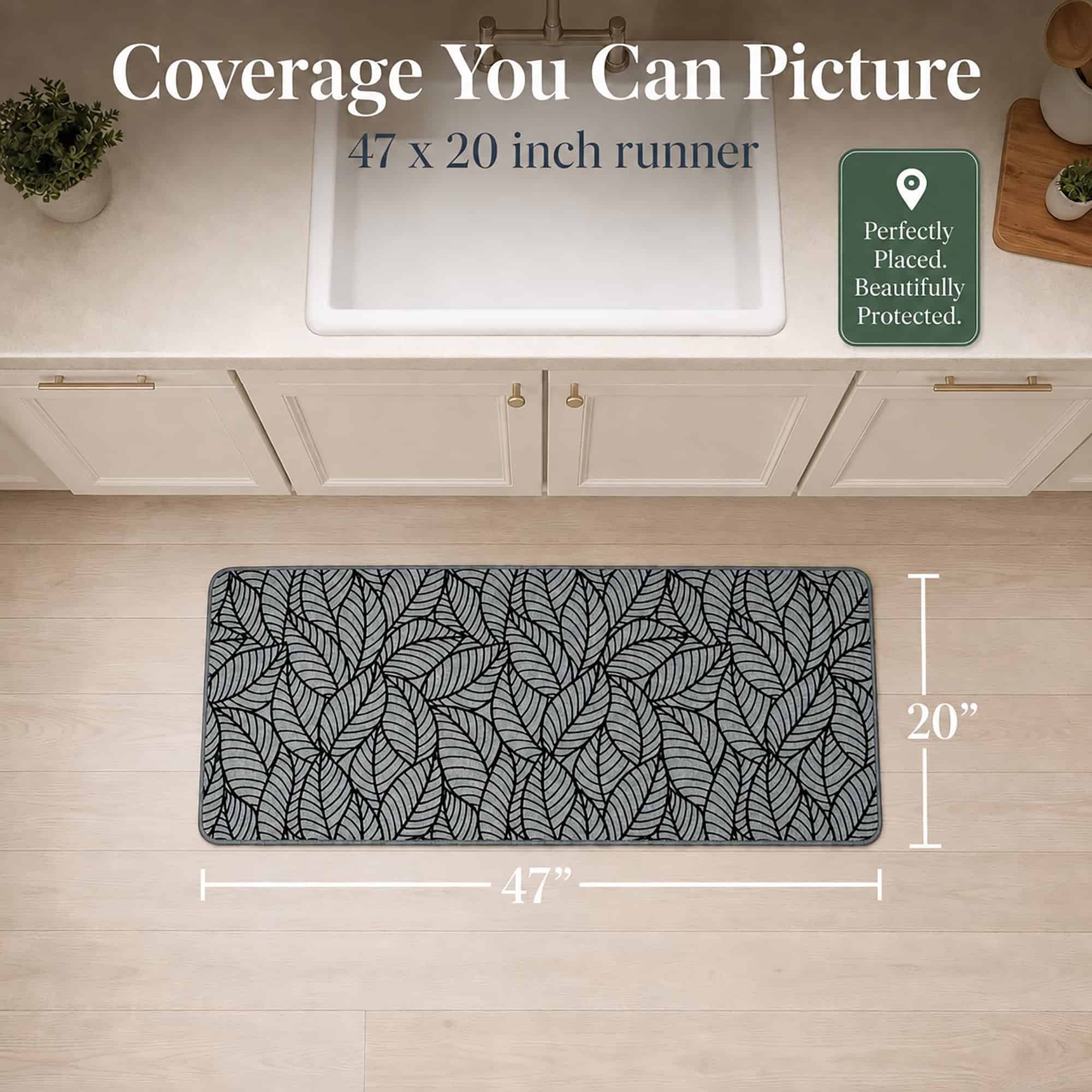 Overhead view of a grey leaf-print kitchen runner with arrows marking forty-seven inches long by twenty inches wide for narrow spaces.