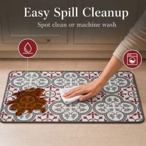 A hand wipes a brown spill from the kitchen mat with a white cloth, with icons showing the mat is spot clean and machine washable.