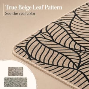 Close-up of a beige kitchen mat showing the true leaf-pattern color, the woven texture and the soft stitched beige border.