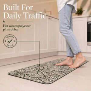 Beige leaf-print kitchen runner showing its flat woven polyester surface and rubber backing, built to handle daily foot traffic.