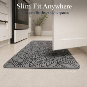 Grey leaf-print kitchen runner lying flat in a bright kitchen, its low two-tenths of an inch profile clearing tight spaces.