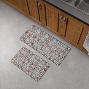 The runner and standard mat placed together on a gray floor in front of wood kitchen cabinets, showing both pieces of the set.