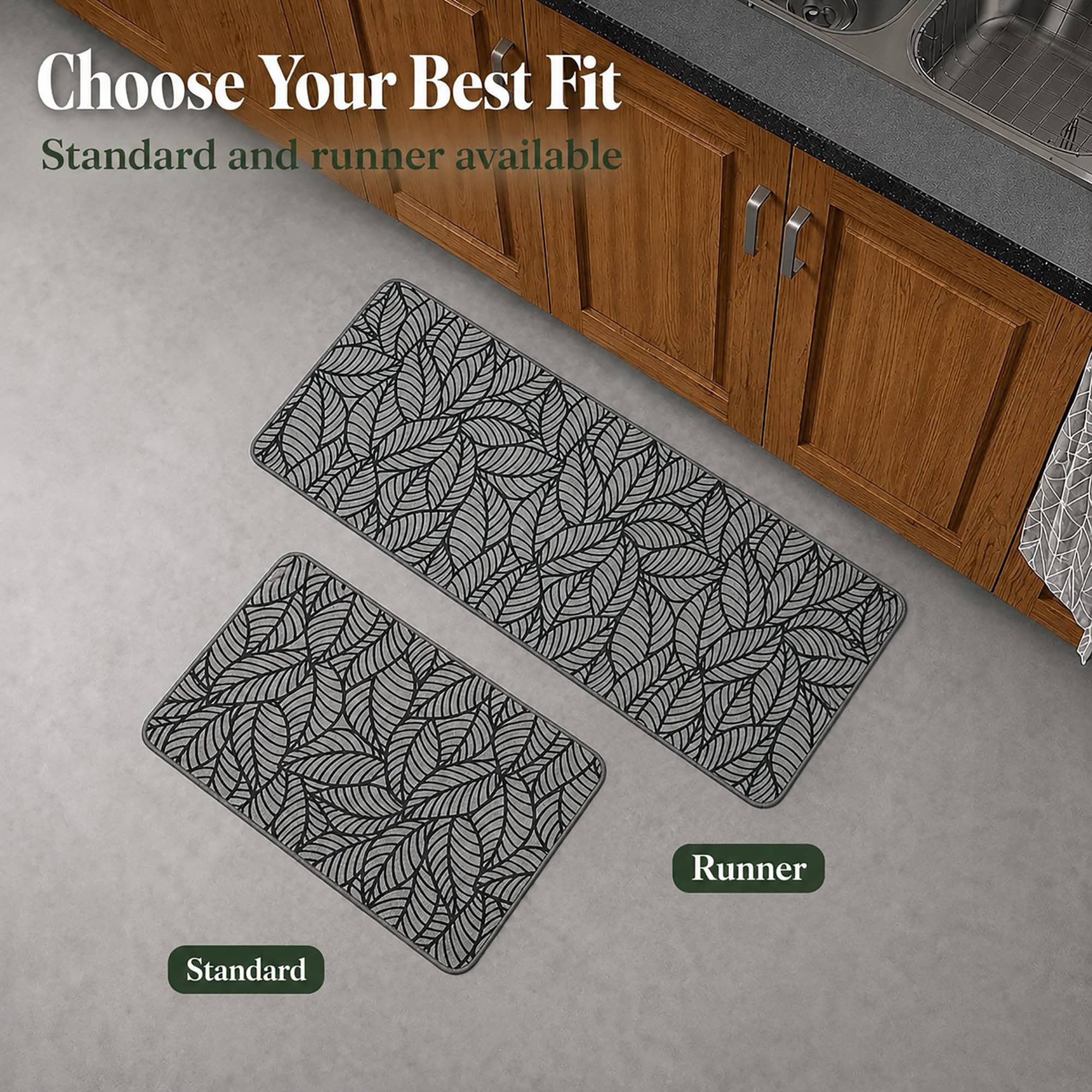 A grey leaf-print kitchen mat and longer runner shown together on the floor, illustrating the standard and runner size options.
